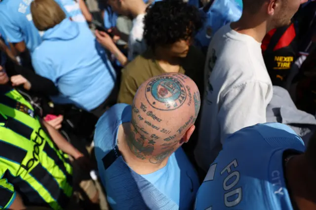 Man City fan with a tattooed head