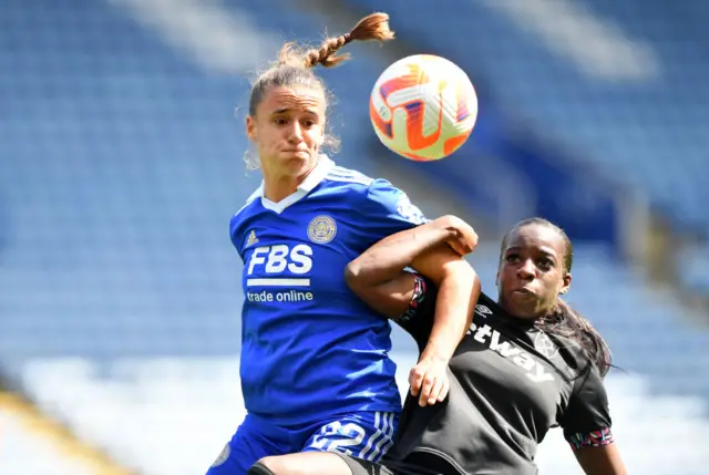 Leicester and West Ham players battle for the ball.