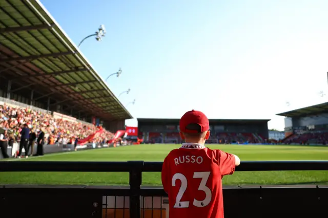 A young fan eagerly awaits kick off at Leigh.