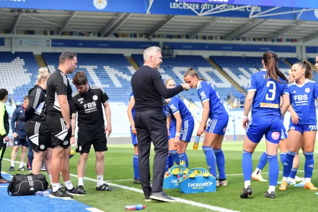 Willie Kirk gives instructions to his Man City players.