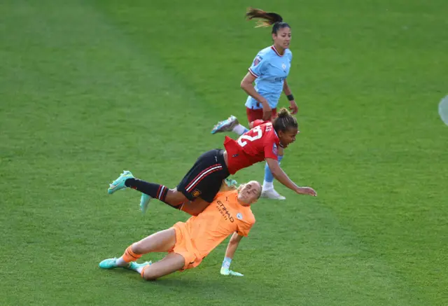 Ellie Roebuck flies into a challenge on Nikita Parris.