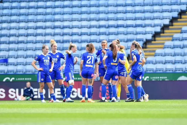 Leicester players huddle before kick off.