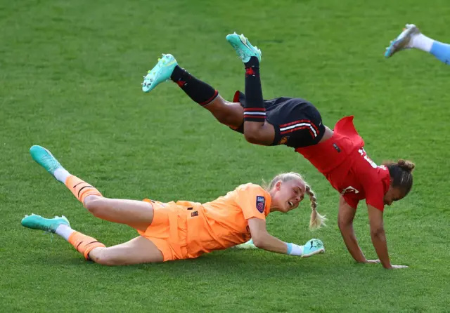 Manchester City's Ellie Roebuck fouls Manchester United's Nikita Parris and subsequently receives a red card and is sent off