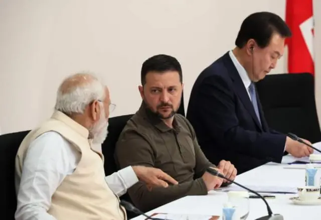 Indian Prime Minister Narendra Modi talks to Zelensky at a meeting