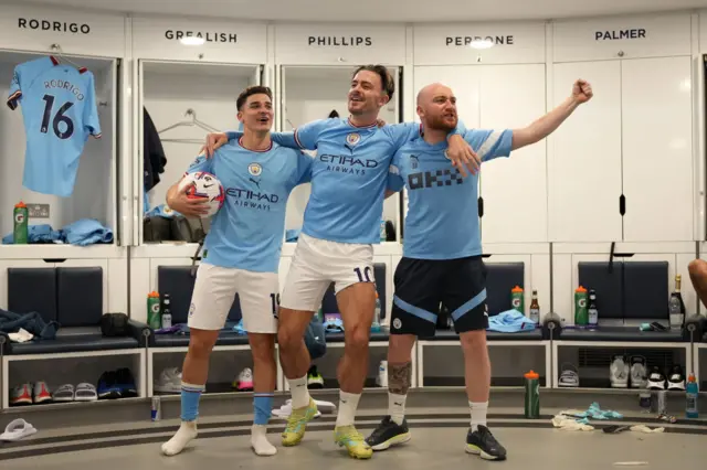 Julian Alvarez and Jack Grealish in the changing room