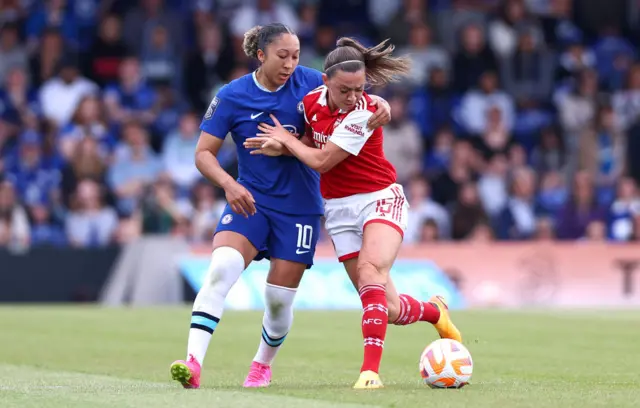 Lauren James and Katie McCabe battling for the ball