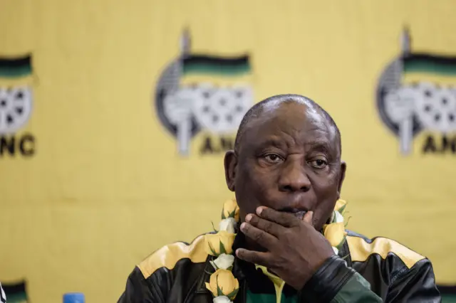 South African President Cyril Ramaphosa looks on as he addresses new members of the African National Congress (ANC