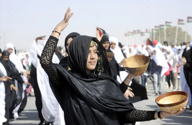 Sahrawi women attend a parade celebrating the 50th anniversary of the Polisario Front and the outbreak of the armed struggle for the independence of Western Sahara in Aousserd in Tindouf southwest of Algiers, Algeria, May 20, 2023