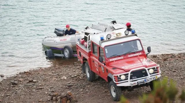 Personnel at Barragem do Arade reservoir, in the Algave, Portugal, as searches begin as part of the investigation into the disappearance of Madeleine McCann.