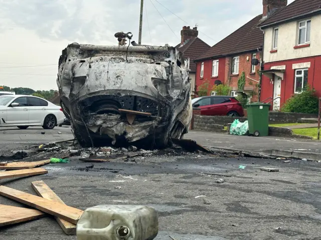 Burnt out car upside down