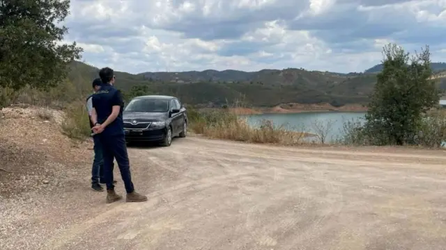 Police at the Arade dam in Portugal on Monday