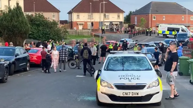 Riot police attended the scene of disorder in the district of Ely in Cardiff