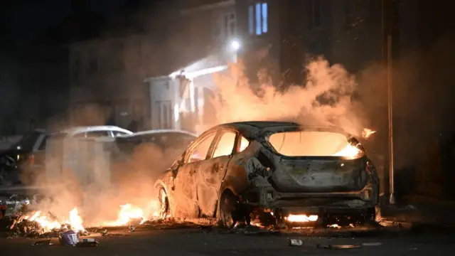 Flames and smoke surround car