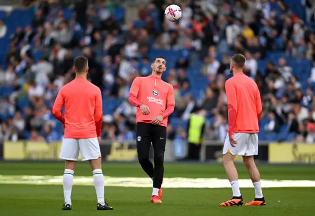 Brighton players warming up ahead of Manchester City match