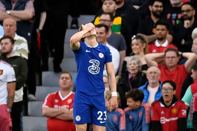 Conor Gallagher holds a hand to his face