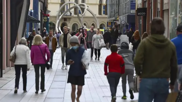 Shoppers in a street in Belfast