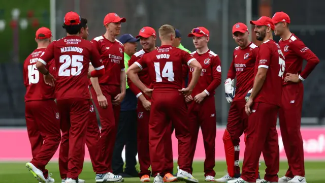 Lancashire players celebrate wicket