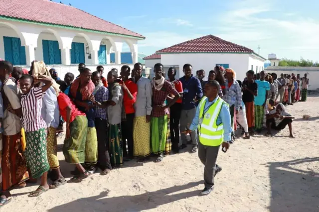 Voters queuing to vote