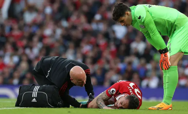 Manchester United's Antony on the floor injured