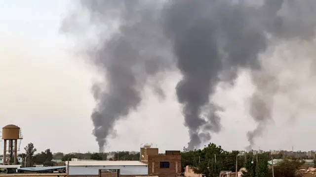 Smoke rises above buildings in Khartoum, Sudan - 24 May 2023