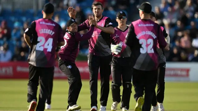 Craig Overton celebrates wicket