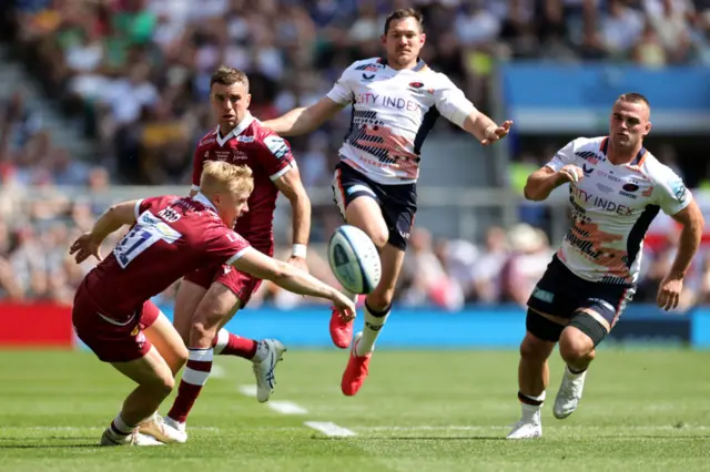 Alex Goode kicks the ball through