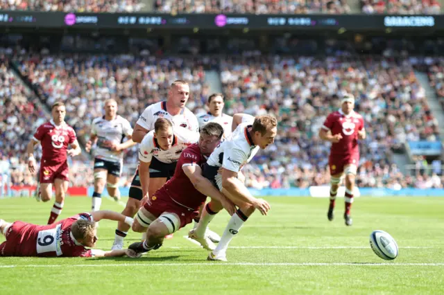 Tom Curry tackles Max Malins off the ball