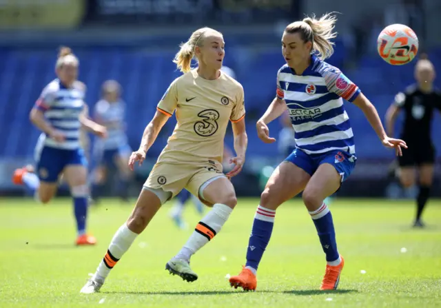 Pernille Harder chips the ball over a Reading defender.