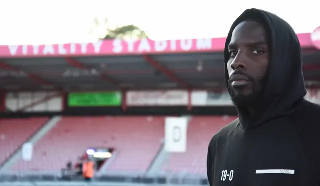 Okolie staring into the distance at Vitality Stadium