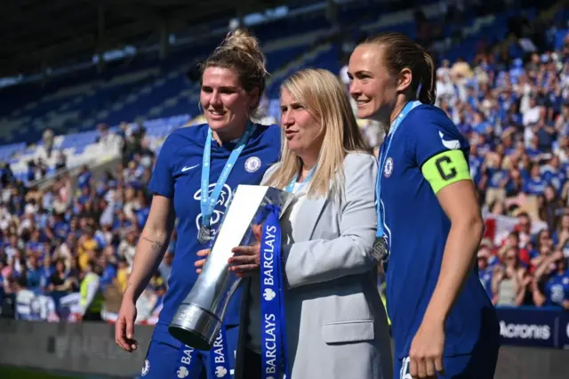 Bright, Hayes and Eriksson pose with the WSL trophy.