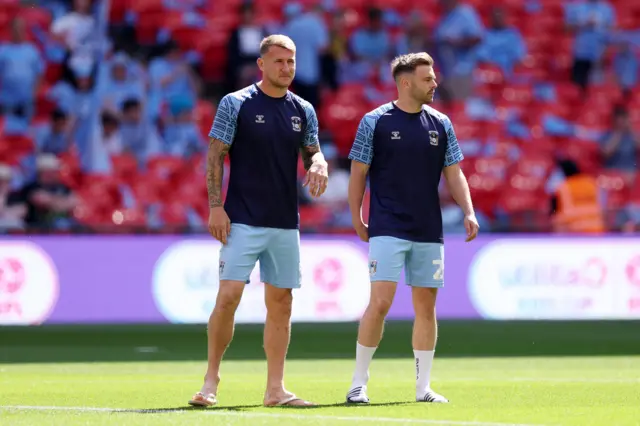 Kyle McFadzean and Matty Godden inspect the Wembley pitch