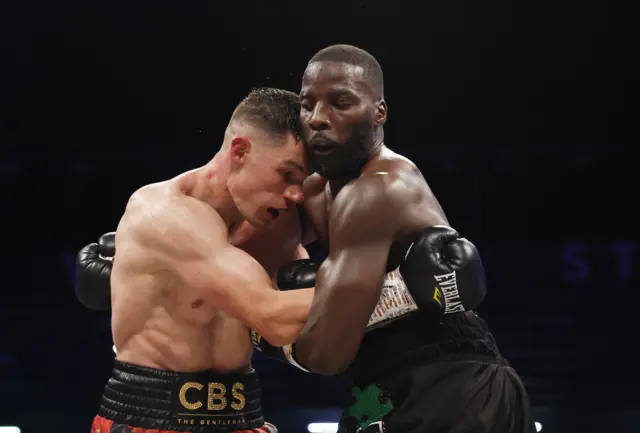 Lawrence Okolie holds Chris BIllam-Smith