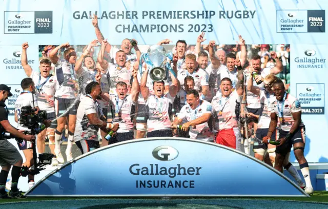 Saracens celebrate with the Premiership trophy