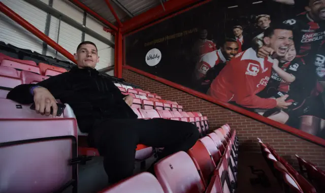 Billam-Smith sitting in the stands at Vitality Stadium