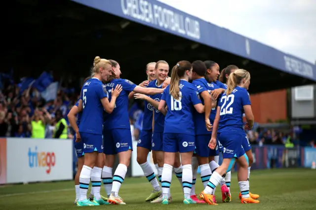 Chelsea players celebrate a goal v Arsenal in the WSL