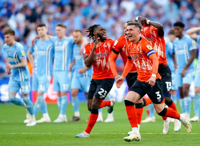 Luton players celebrate their shootout win against Coventry