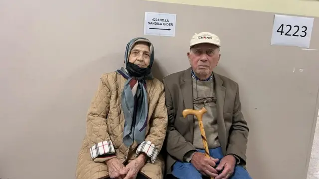 Couple outside a polling station in Ankara