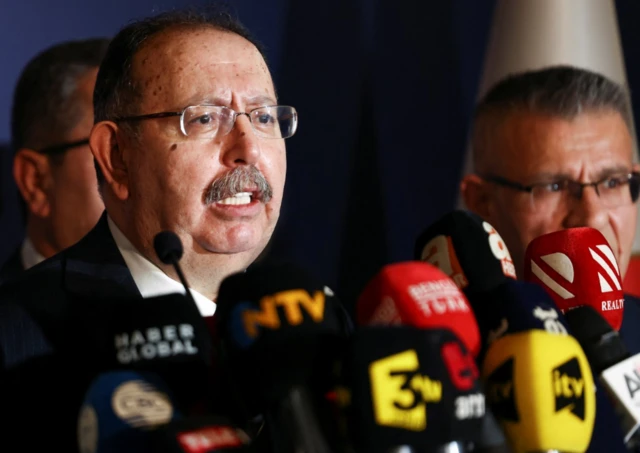 Ahmet Yener, head of Turkey's High Election Board (YSK), speaks to the media following early exit poll results for the second round of the presidential election in Ankara