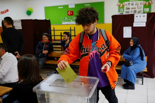 A person votes during the second round of the presidential election in Istanbul