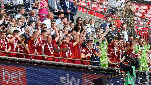 Carlisle lift the trophy