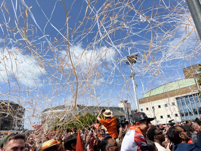 Streamers over crowd at St George's Square