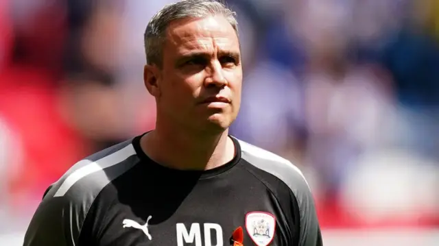 Barnsley manager Michael Duff walks on the pitch at Wembley