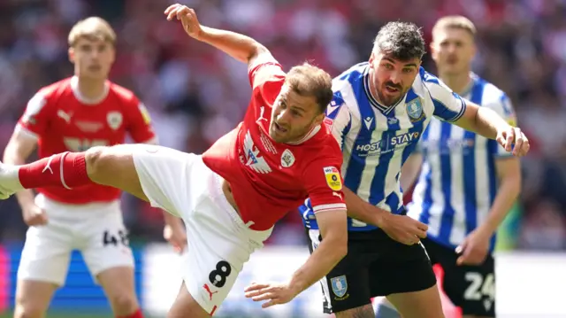 Calum Paterson challenges for the ball