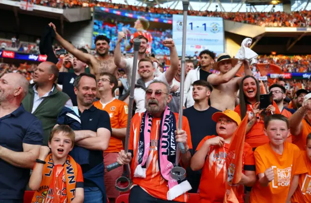 Luton Town fans celebrate after winning the Championship Play-Off Final Action