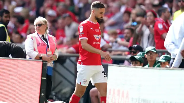 Adam Phillips walks away after being sent off