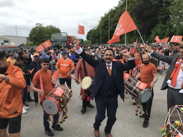 Aslam Khan, deputy leader of Luton Council, with fellow fans at Kenilworth Road.