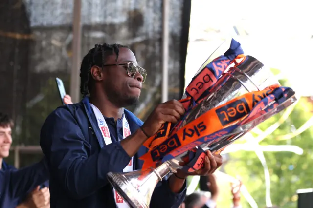 Pelly-Ruddock Mpanzu with the play-off final trophy