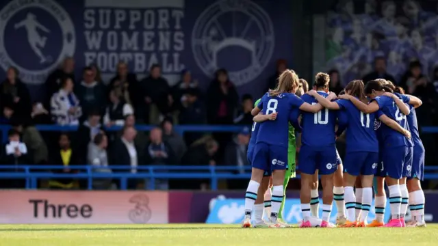 Chelsea players in a huddle