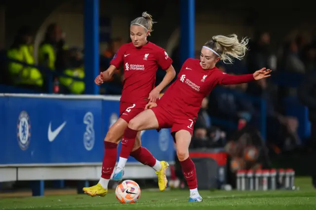 Liverpool players battle for the ball