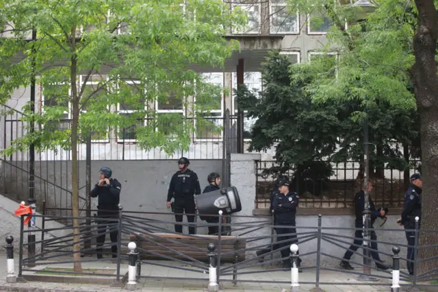 Officers wearing helmets and bulletproof vests